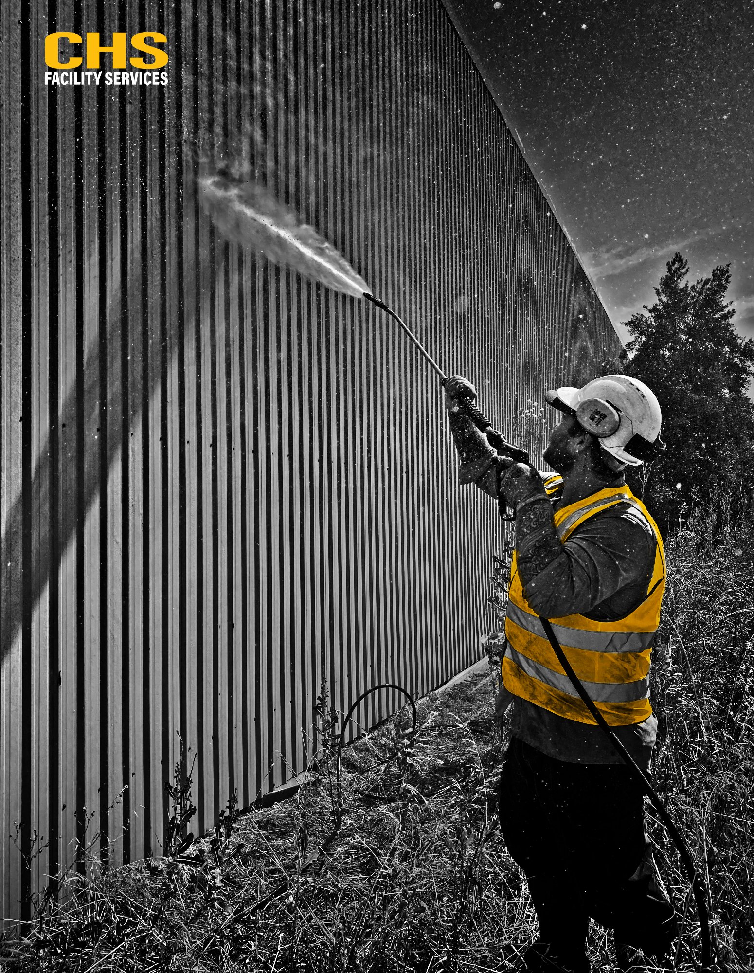 CHS technician pressure washing industrial building Adelaide